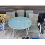 A METAL GARDEN TABLE WITH GLASS TOP ALONG WITH FOUR MATCHING GARDEN CHAIRS