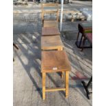 FOUR BEECH HIGH STOOLS AND ONE STOOL WITH BACK