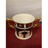 A ROYAL CROWN DERBY TWIN HANDLED CUP 7.5CM TALL