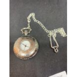 AN ORNATE WHITE METAL POCKET WATCH AND CHAIN