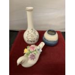 THREE ROYAL DOULTON ITEMS TO INCLUDE A SMALL BLUE FLAMBE VASE, A BUD VASE AND A DOVE WITH FLOWERS