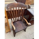 A VICTORIAN ELM AND BEECH ROCKING CHAIR