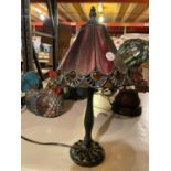 A TIFFANY STYLE BEDSIDE LAMP WITH METAL BASE