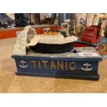 A CAST IRON MONEY BOX DEPICTING THE TITANIC