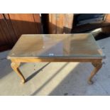 A WALNUT COFFEE TABLE ON CABRIOLE LEGS