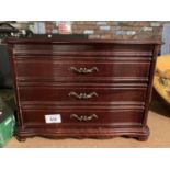 A WOODEN JEWELLERY BOX WITH HINGED LID AND TWO DRAWERS