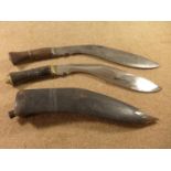 A LARGE KUKRI KNIFE, 31CM BLADE AND ANOTHER KUKRI, 27CM BLADE