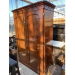 A VICTORIAN MAHOGANY ARCHED TWO DOOR WARDROBE, 60" WIDE, WITH DRAWER TO THE BASE