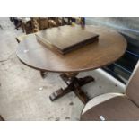 AN OAK JAYCEE JACOBEAN STYLE CIRCULAR EXTENDING DINING TABLE ON SINGLE PEDESTAL, 44" DIAMETER (