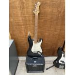 A 'SQUIRE STRAT' ELECTRIC GUITAR AND A PEAVEY AMPLIFIER