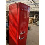 A LARGE RED SMEG FRIDGE FREEZER BELIEVED IN WORKING ORDER BUT NO WARRANTY