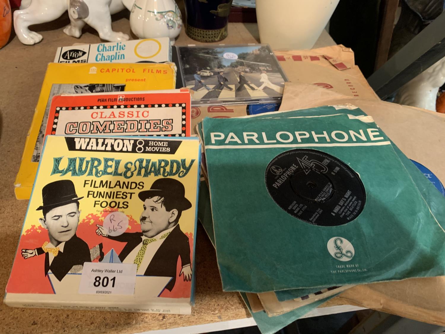 A QUANTITY OF BEATLES SINGLES, ELVIS 78'S AND 8 MM FILMS TO INCLUDE LAUREL AND HARDY