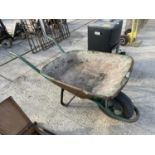 A LARGE METAL WHEEL BARROW WITH RUBBER TYRE WHEEL