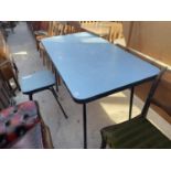 A BLUE 1950'S FORMICA TOPPED KITCHEN TABLE ON BLACK TUBULAR METAL BASE AND SIMILAR STOOL WITH REXENE