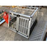 A DOG CRATE FOR THE BACK OF A VEHICLE