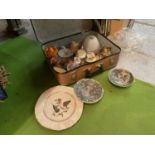 A SMALL VINTAGE SUITCASE CONTAINING AN ECLECTIC ASSORTMENT OF ITEMS
