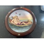 A WOODEN FRAMED CIRCULAR MINTON PLAQUE BY LUCIEN BOULLEMIER OF A MOTHER AND CHILD ON A GONDALA