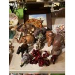 AN ASSORTMENT OF TRIBAL ITEMS TO INCLUDE ELEPHANT ORNAMENTS, A TREEN TRIBAL BUST AND A FRAMED TRIBAL