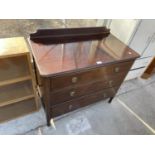 AN EDWARDIAN MAHOGANY CHEST OF THREE GRADUATED DRAWERS, 36" WIDE