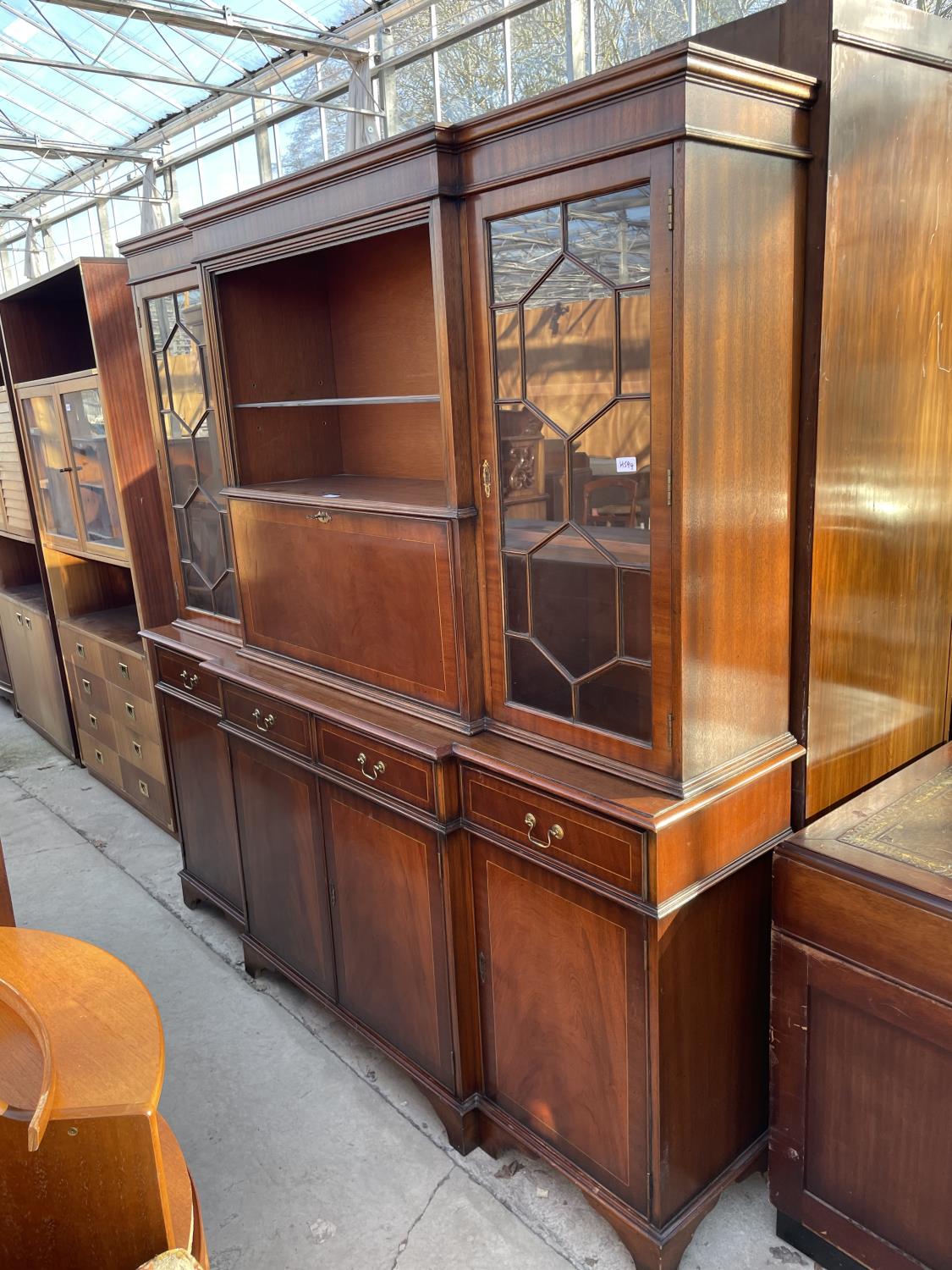 A REPRODUCTION MAHOGANY AND INLAID BREAKFRONT BOOKCASE WITH TWO ASTRAGAL GLAZED DOORS, CENTRE