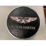 A ROUND CAST METAL 'ASTON MARTIN' SIGN