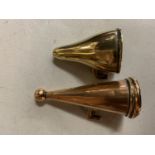 TWO CANDLE SNUFFERS ONE BEING BRASS AND THE OTHER COPPER