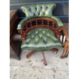 A 19TH CENTURY STYLE REVOLVING BUTTON-BACK OFFICE TUB CHAIR WITH TURNED UPRIGHTS