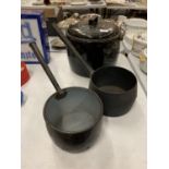A LARGE ENAMEL LIDDED COOK POT AND TWO SAUCEPANS ONE BEING CAST IRON