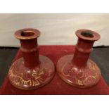 A PAIR OF BURLEYWARE CHARLOTTE RHEAD CANDLESTICKS