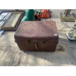 A VINTAGE TIN TRUNK