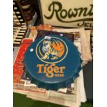 A 'TIGER BEER' BOTTLE TOP SIGN