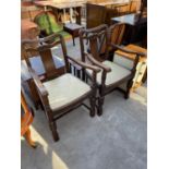 A PAIR OF EARLY 20TH CENTURY OAK OPEN CARVER CHAIRS