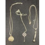 THREE SILVER NECKLACES WITH PENDANTS TO INCLUDE A SHELL, KEY AND DROP