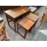 A McINTOSH RETRO TEAK NEST OF THREE TABLES WITH SWIVEL FOLD-OVER TOP