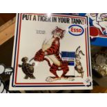 A METAL 'ESSO PUT A TIGER IN YOUR TANK' SIGN