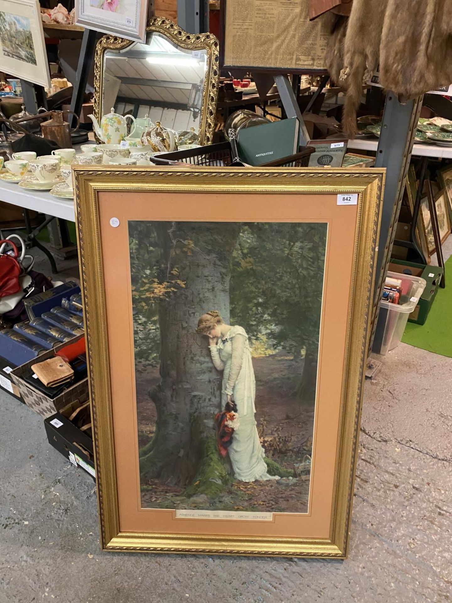 A LARGE GILT FRAMED PICTURE 'ABSENCE MAKES THE HEART GROW FONDER' (91CMS HIGH 60CMS WIDE)