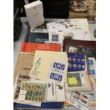A LARGE QUANTITY OF WORLD STAMPS TO INCLUDE TWO BOOKS OF FIRST DAY COVER STAMPS 'THE TWELVE DAYS