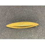 A MARKED 15 CARAT GOLD BROOCH GROSS WEIGHT 2.1 GRAMS