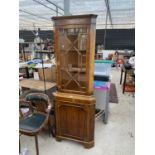 A MODERN YEW WOOD CORNER CUPBOARD