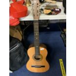 AN ENCORE ACOUSTIC GUITAR