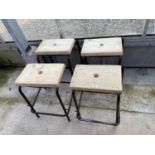 FOUR TUBULAR STACKING STOOLS