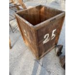 A VINTAGE WOODEN FOUR WHEELED CART/TROLLEY