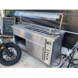 AN INDUSTRIAL KITCHEN COUNTER INCLOSING HEAT LAMPS, TRAY HOLDERS AND A WARMING CUPBOARD