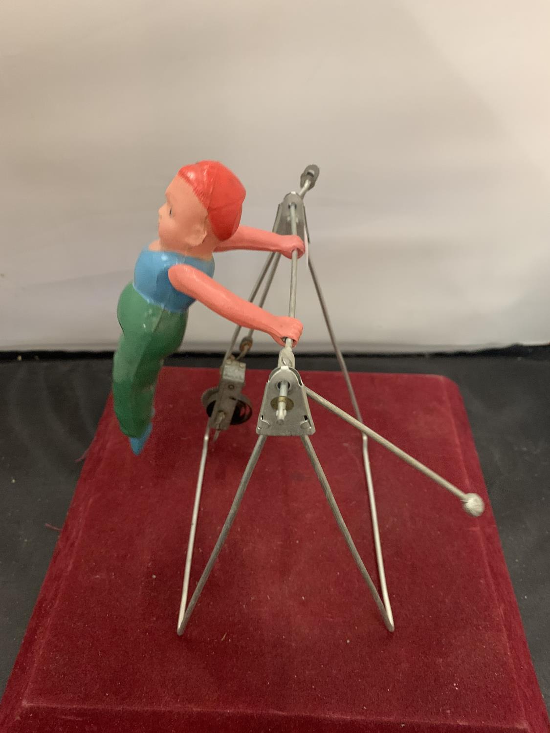 A 1950s GYRATING TOY IN THE FORM OF A GYMNAST - Image 2 of 3
