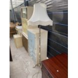 A MODERN ONYX AND GILT METAL STANDARD LAMP COMPLETE WITH SHADE