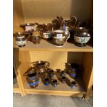 A LARGE QUANTITY OF VARIOUS SIZED LUSTRE WARE JUGS