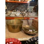 A LARGE BRASS PRESERVING PAN AND A BRASS BEDWARMER