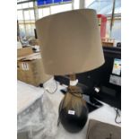 A DECORATIVE TABLE LAMP WITH SHADE