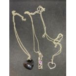 THREE SILVER NECKLACES WITH PENDANTS