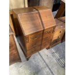 AN EDWARDIAN MAHOGANY AND INLAID BUREAU, 24" WIDE